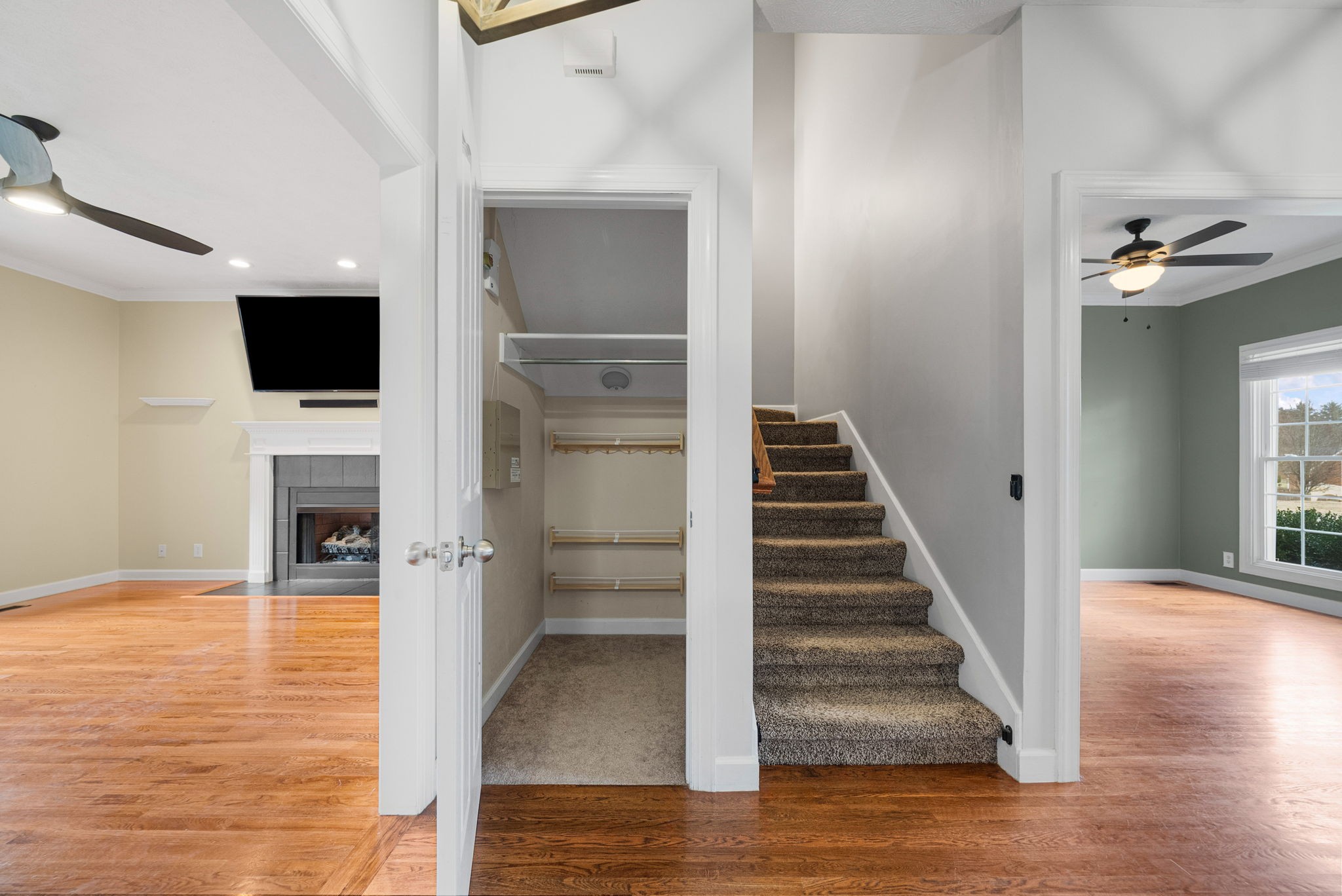 1026 Bluejay Lane Adams, TN 37010 - Photo 13 of 56 a view of a livingroom with wooden floor and staircase