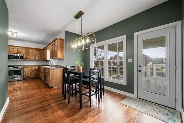 a kitchen with granite countertop cabinets and window