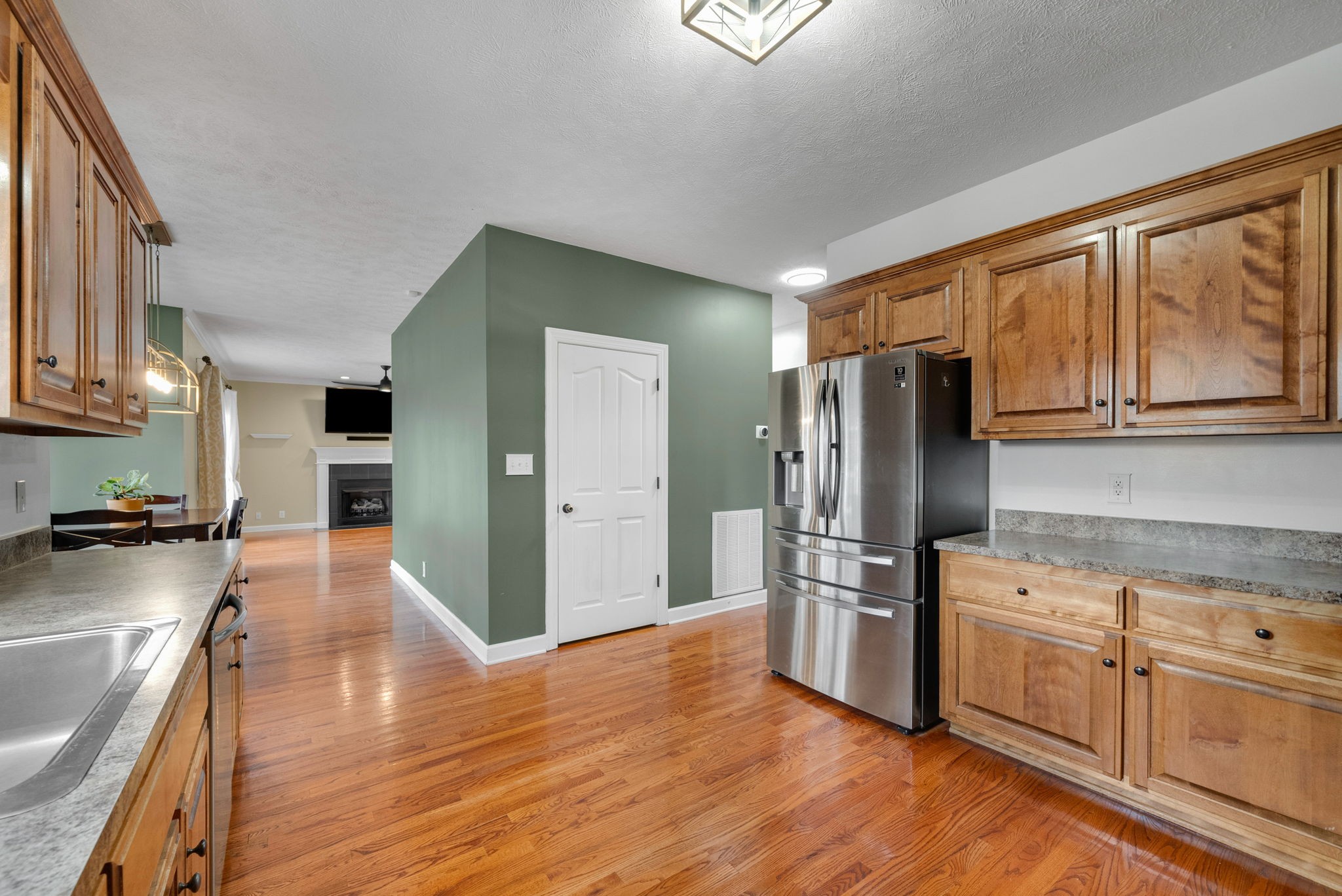 1026 Bluejay Lane Adams, TN 37010 - Photo 21 of 56 a kitchen with stainless steel appliances granite countertop a refrigerator stove top oven and sink