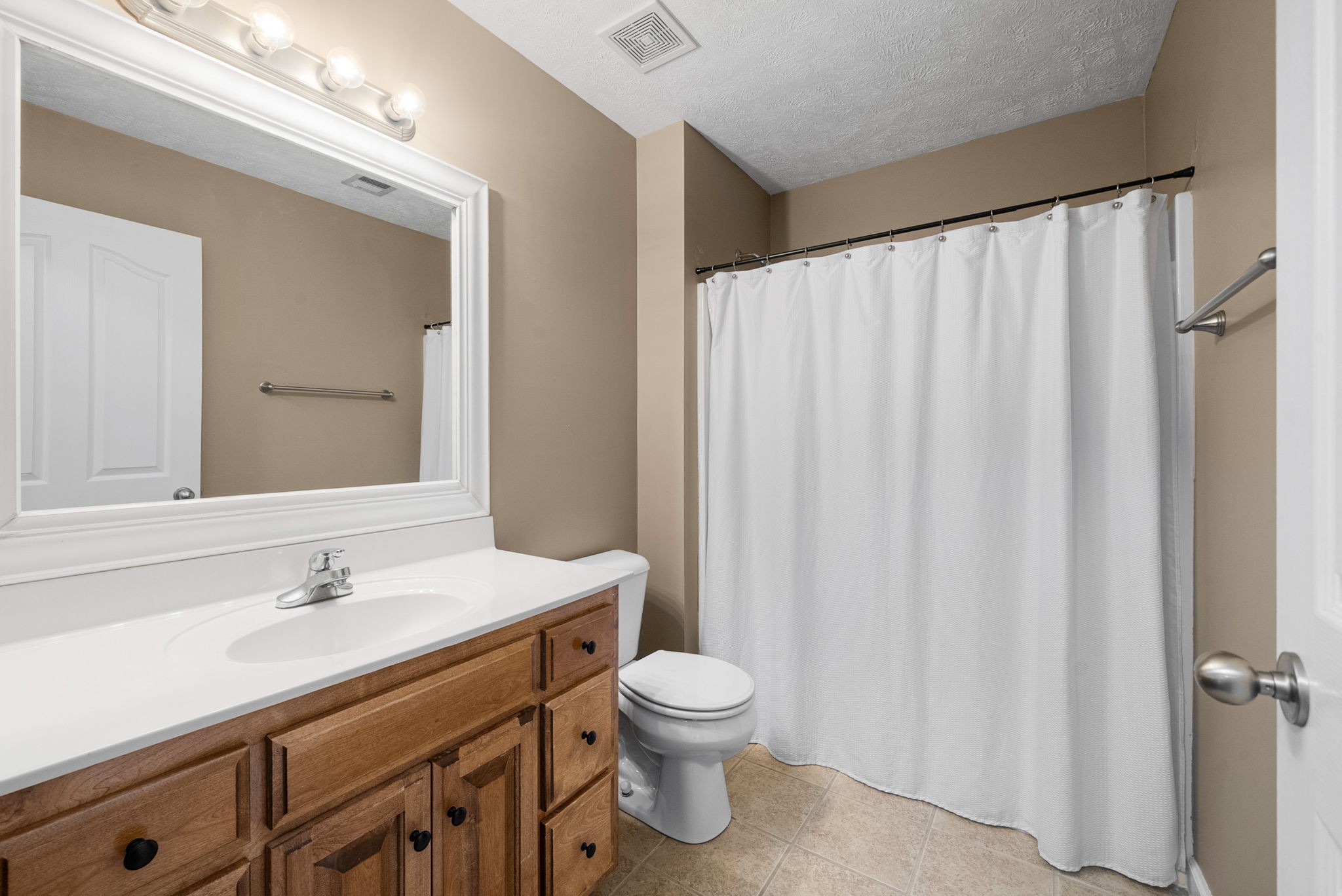 1026 Bluejay Lane Adams, TN 37010 - Photo 36 of 56 a bathroom with a toilet a sink and a mirror