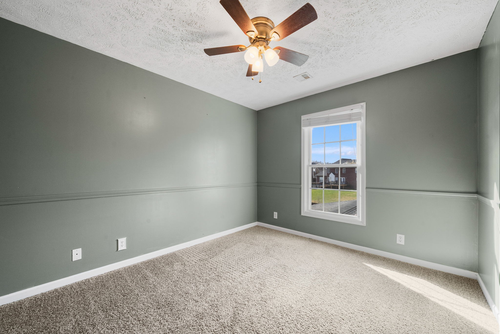 1026 Bluejay Lane Adams, TN 37010 - Photo 37 of 56 an empty room with windows and fan
