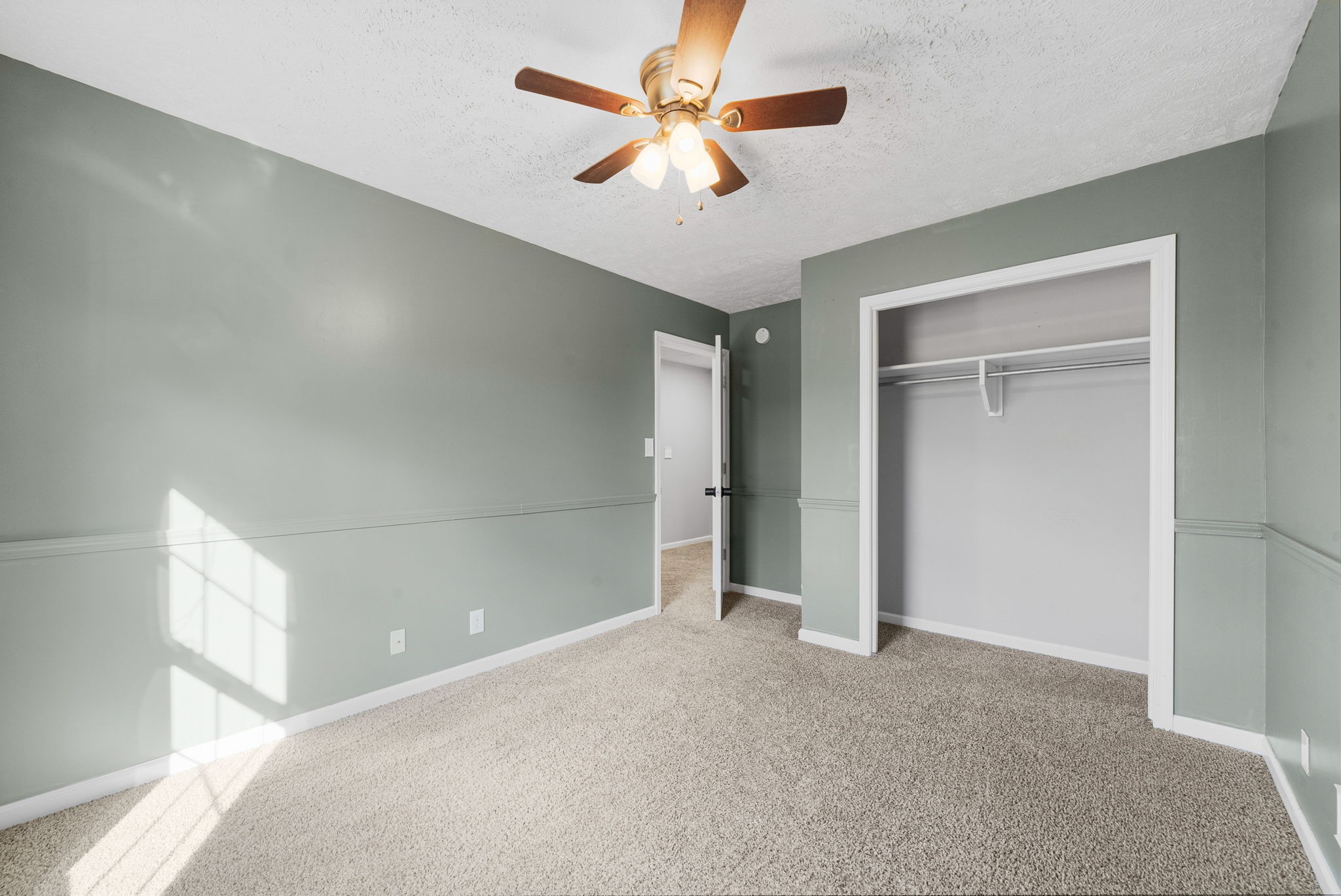 1026 Bluejay Lane Adams, TN 37010 - Photo 38 of 56 an empty room with closet and a ceiling fan