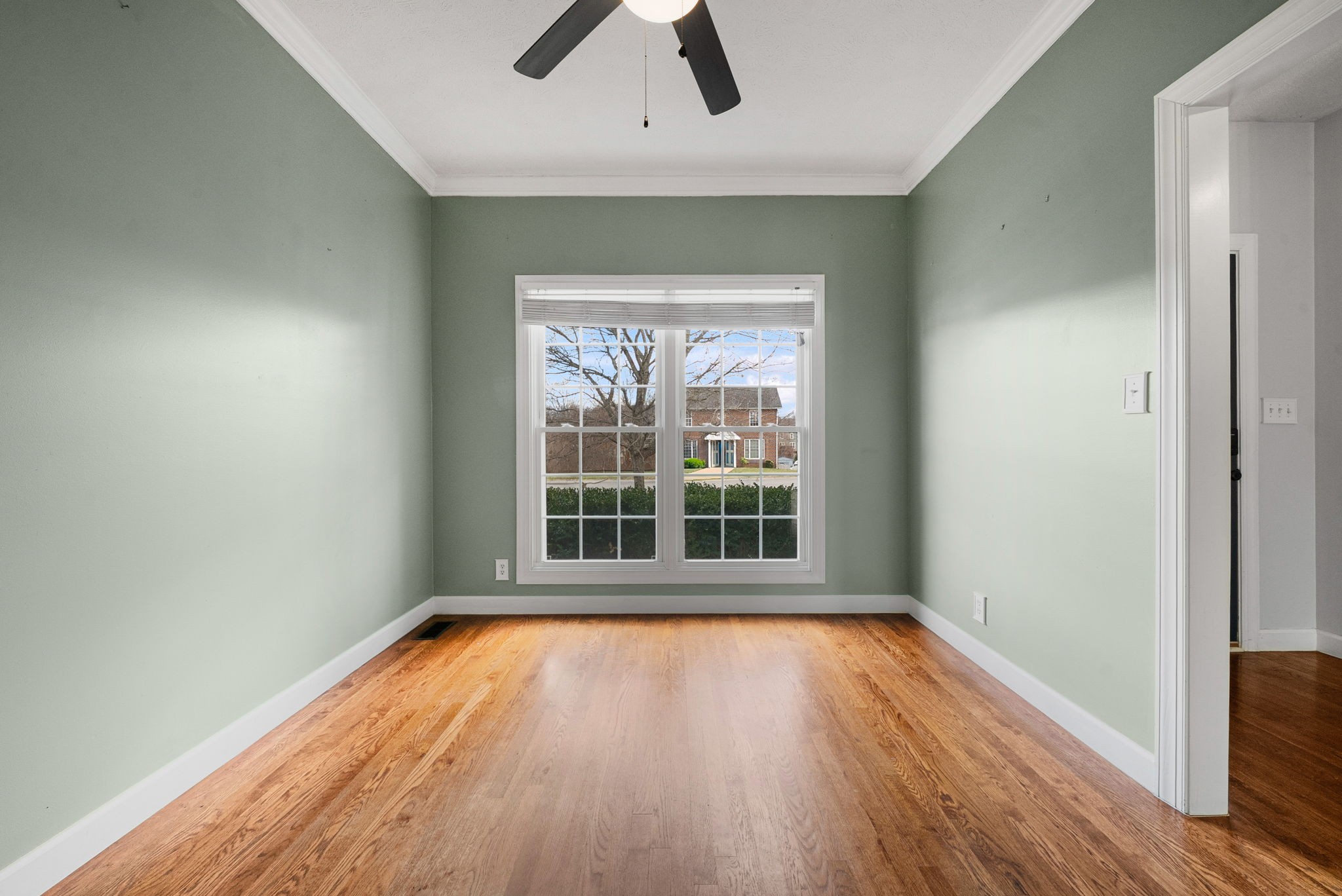 1026 Bluejay Lane Adams, TN 37010 - Photo 10 of 56 an empty room with wooden floor and windows