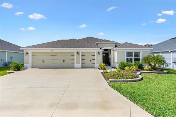 a front view of a house with a garden and porch