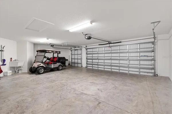 a view of a garage with parked cars