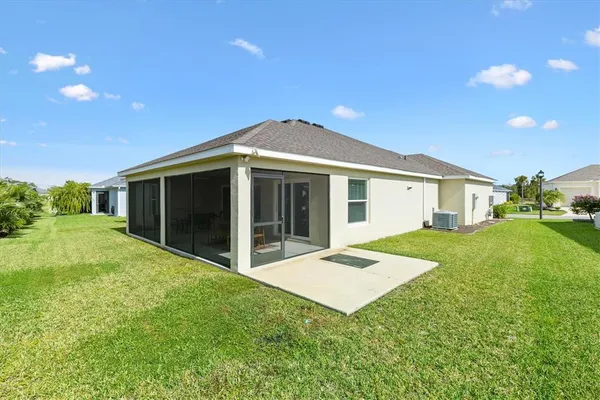 a view of a house with a yard and garden