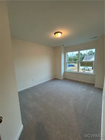 a bathroom with a double vanity sink a toilet and a mirror