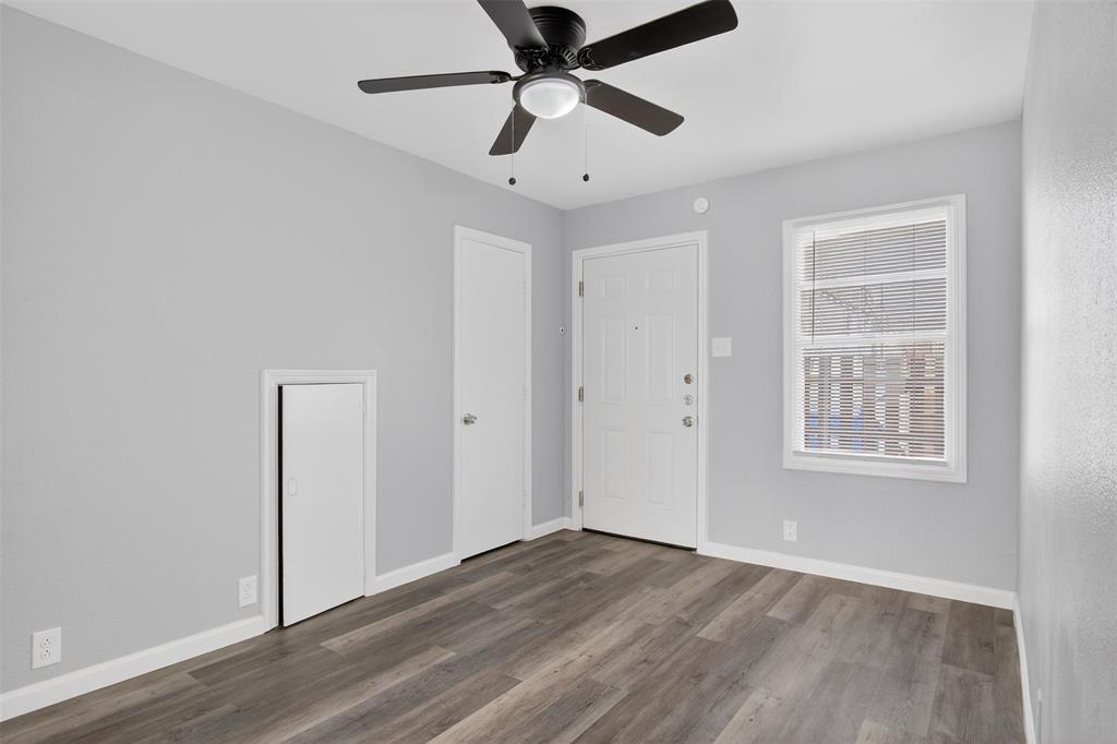 4721 Tremont Street Dallas, TX 75246 - Photo 11 of 22 wooden floor in an empty room with a window