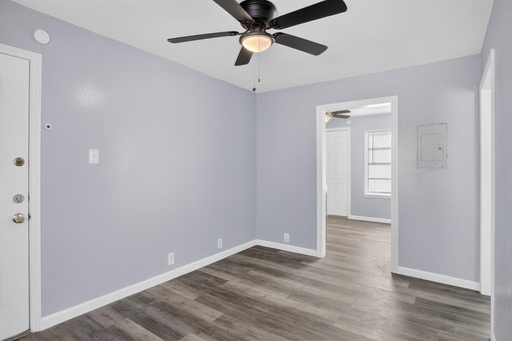 4721 Tremont Street Dallas, TX 75246 - Photo 20 of 22 a view of empty room with wooden floor