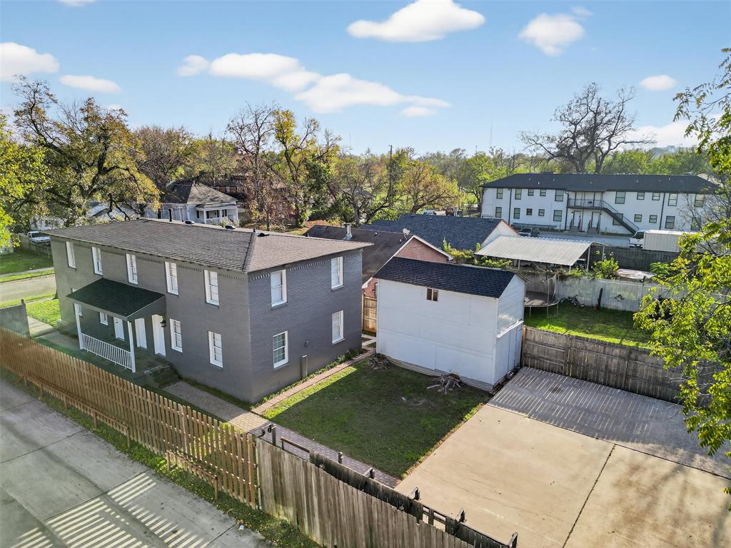 4721 Tremont Street Dallas, TX 75246 - Photo 7 of 22 a view of a house with wooden fence
