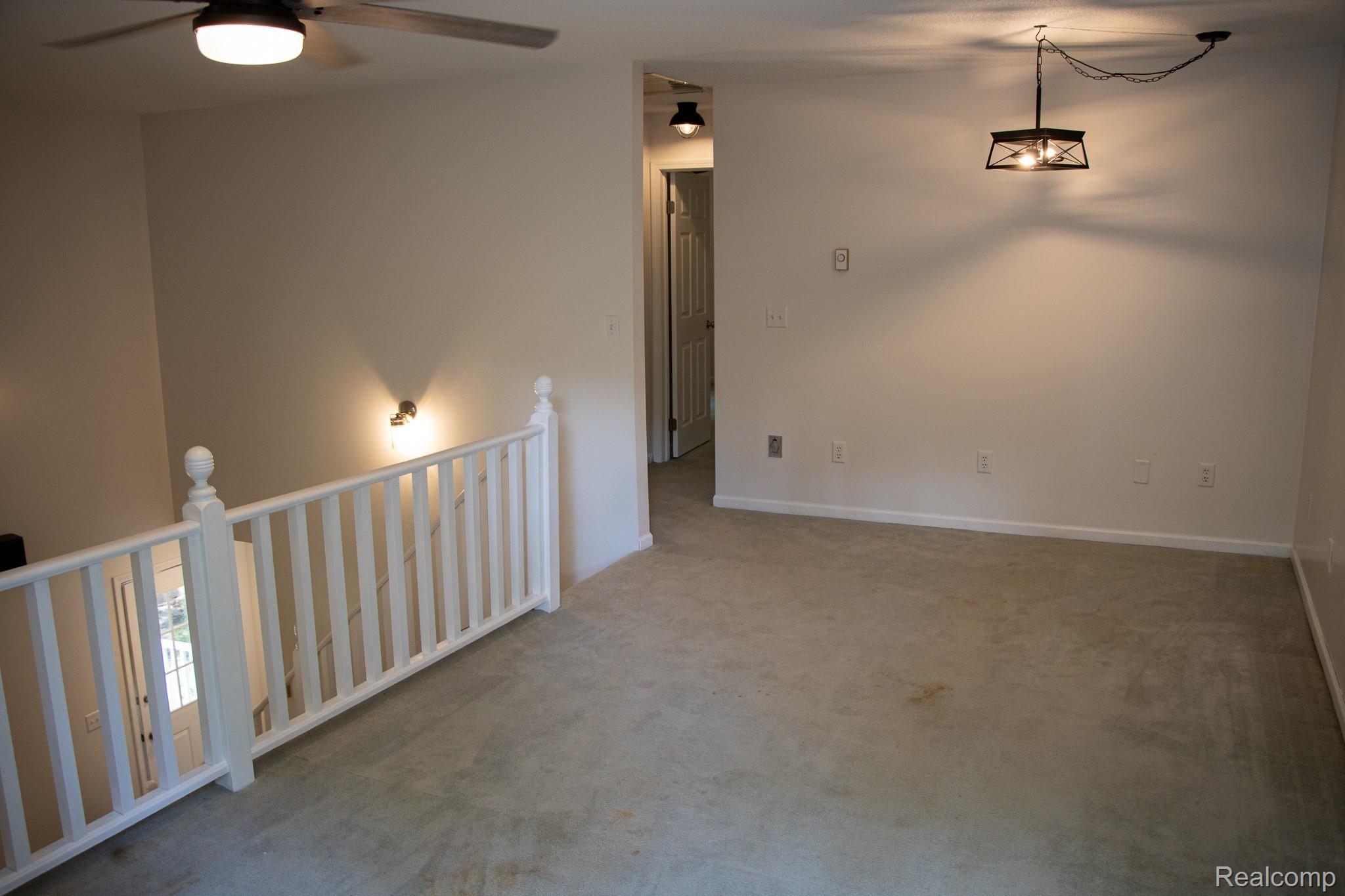 3536 East Allen Road Howell, MI 48855 - Photo 9 of 25 What a great place to retreat to...an open loft for reading or morning coffee with views to your wooded property!
