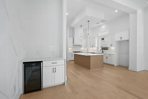 a large kitchen with a lot of counter space and a sink
