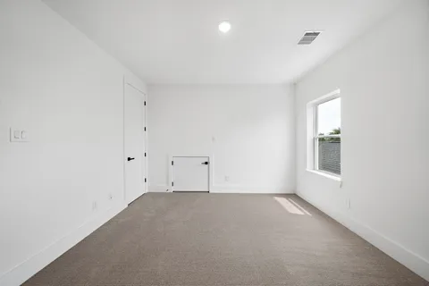 a bathroom with a sink a toilet and a large mirror