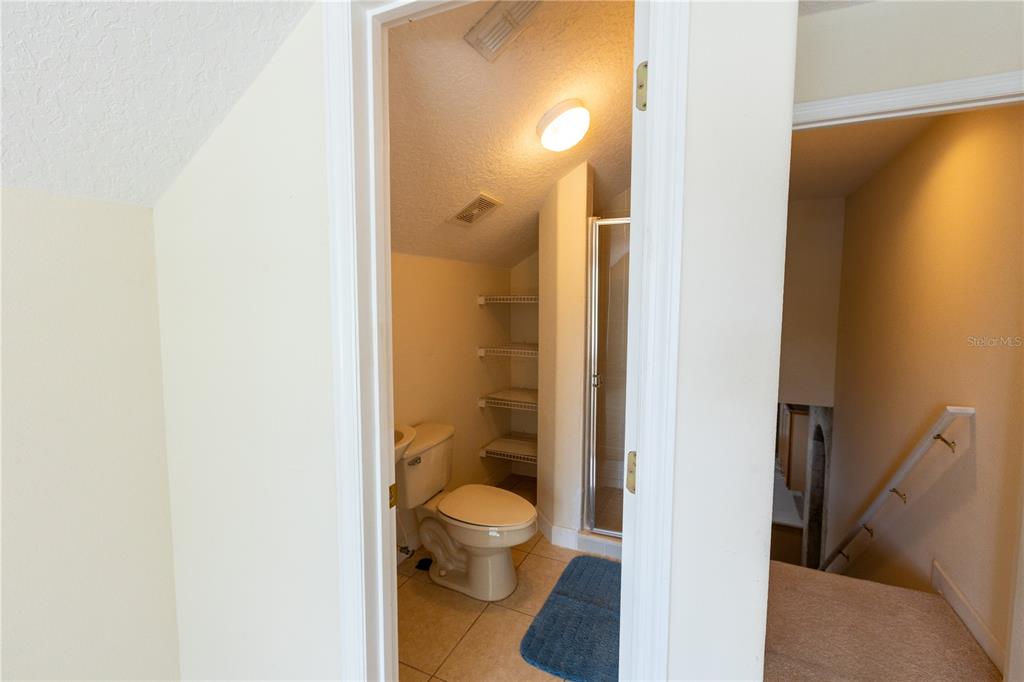 65 Calliope Street Ocoee, FL 34761 - Photo 37 of 60 a bathroom with a toilet and a shower