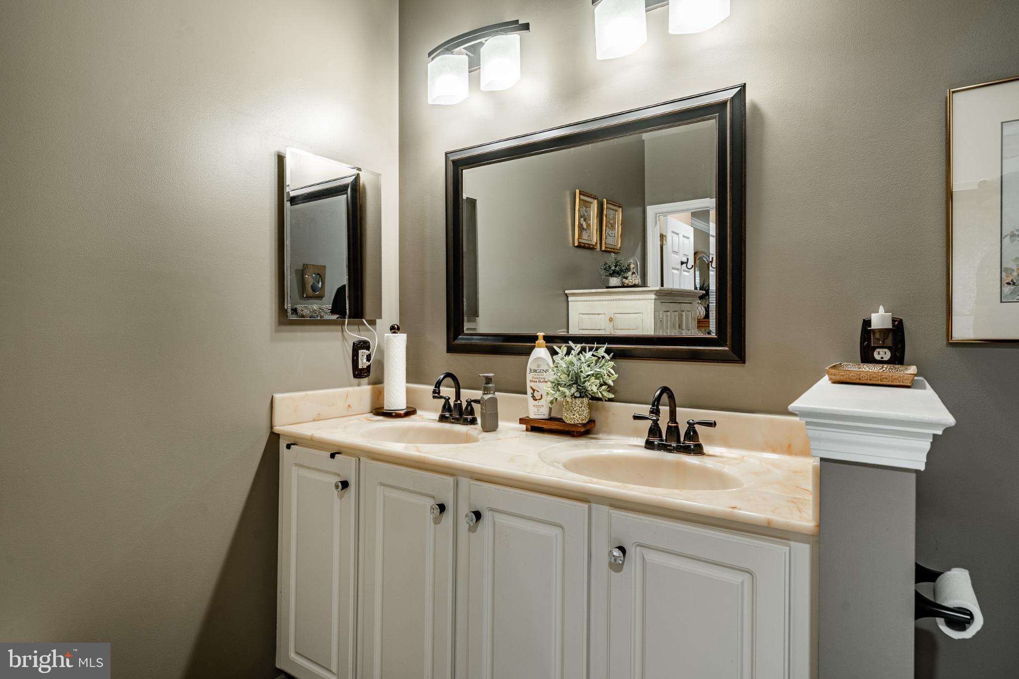 71 Dresner Circle Upper Chichester, PA 19061 - Photo 14 of 46 a bathroom with 2 sink and a mirror