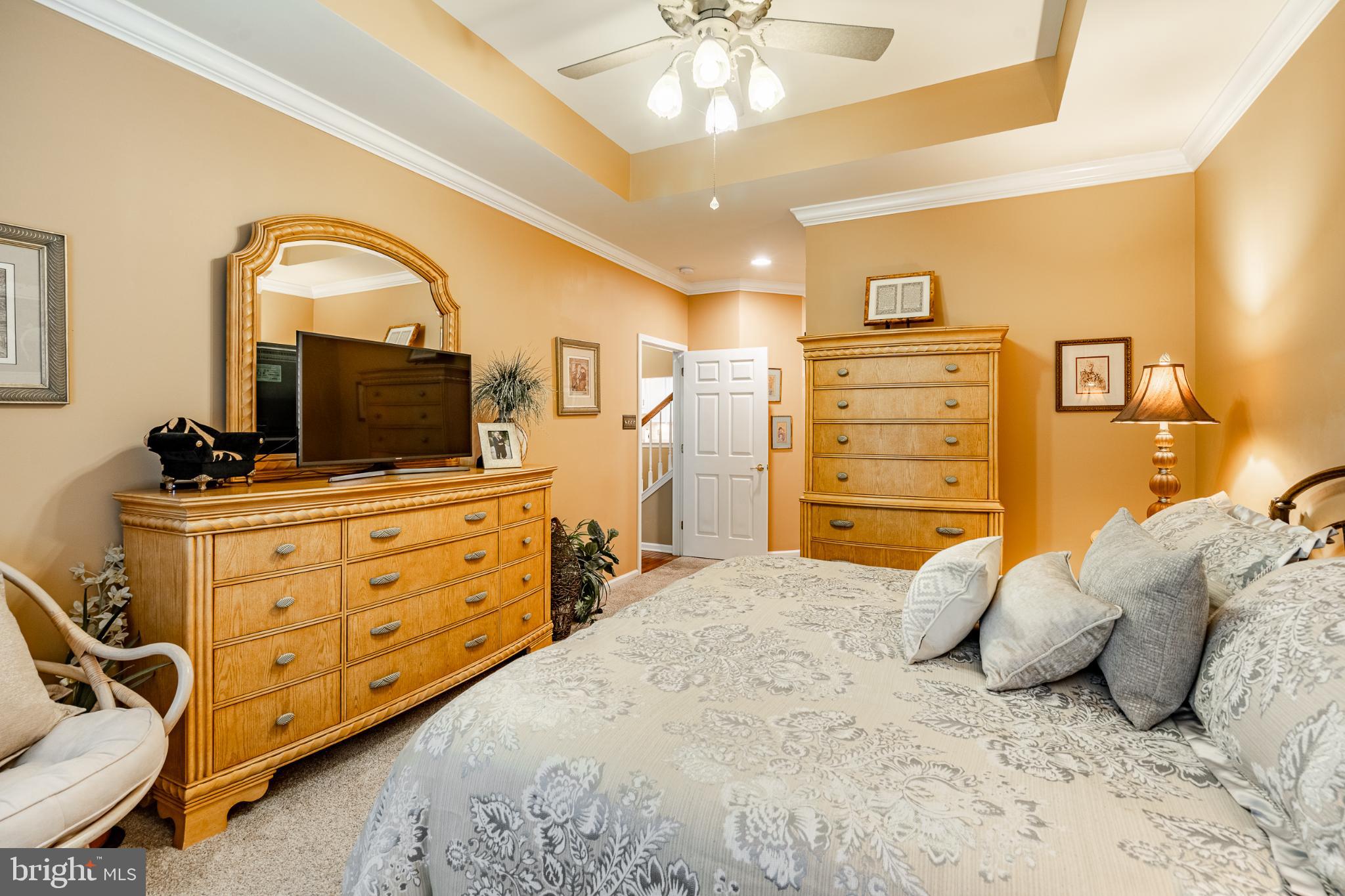 71 Dresner Circle Upper Chichester, PA 19061 - Photo 16 of 46 a bedroom with a bed and a flat tv screen on dresser