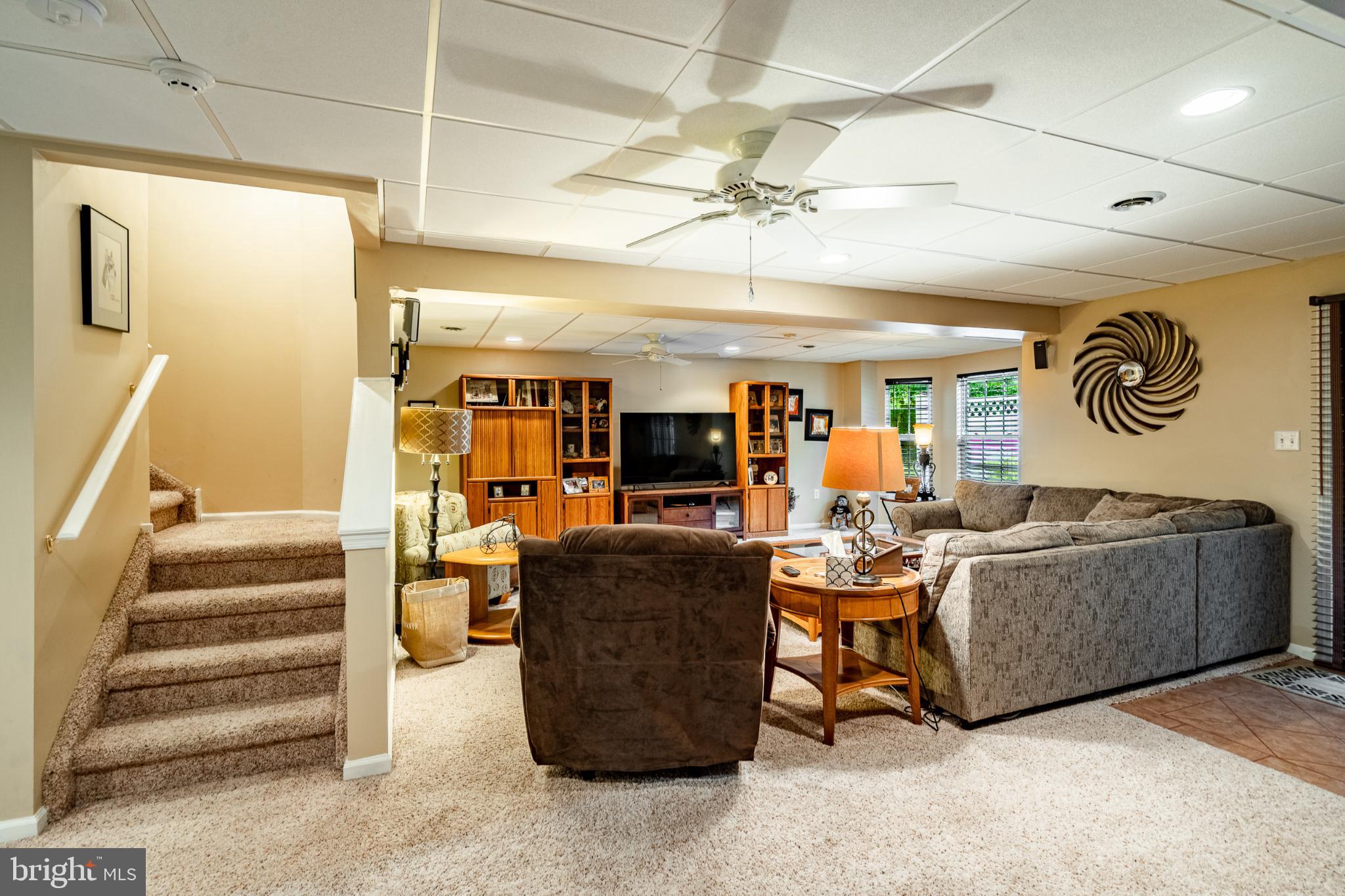 71 Dresner Circle Upper Chichester, PA 19061 - Photo 32 of 46 a living room with furniture and a ceiling fan