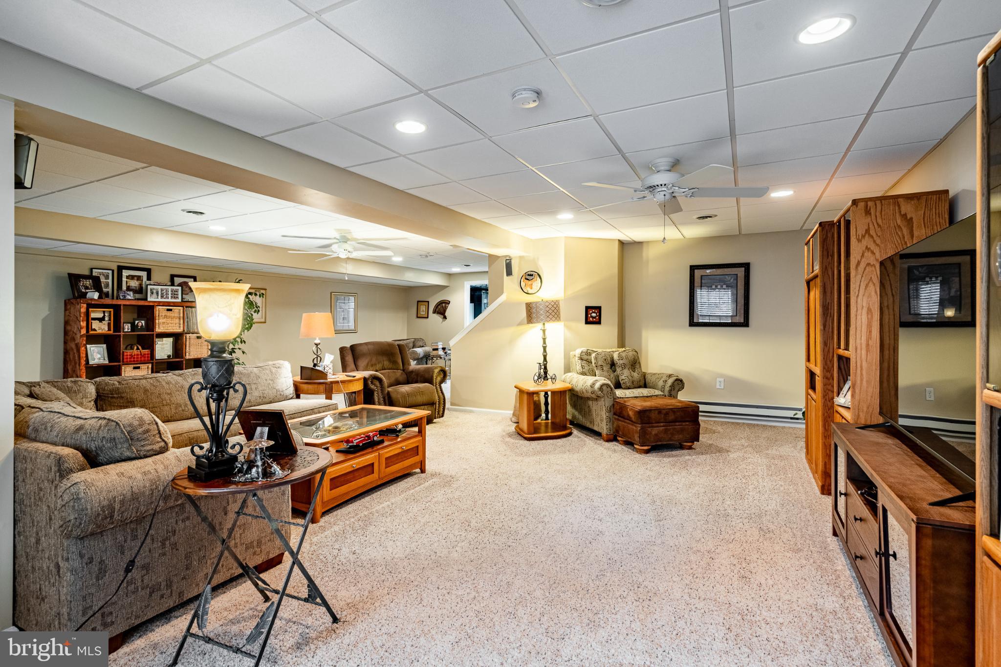 71 Dresner Circle Upper Chichester, PA 19061 - Photo 34 of 46 a living room with furniture and a flat screen tv