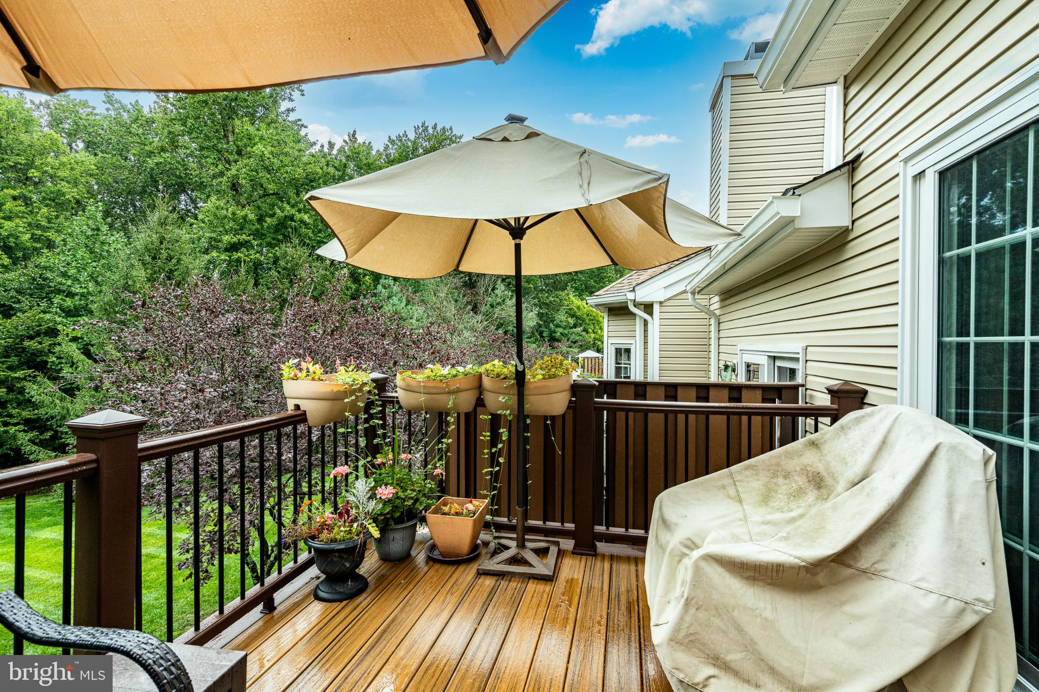 71 Dresner Circle Upper Chichester, PA 19061 - Photo 40 of 46 a view of a balcony with furniture and umbrella
