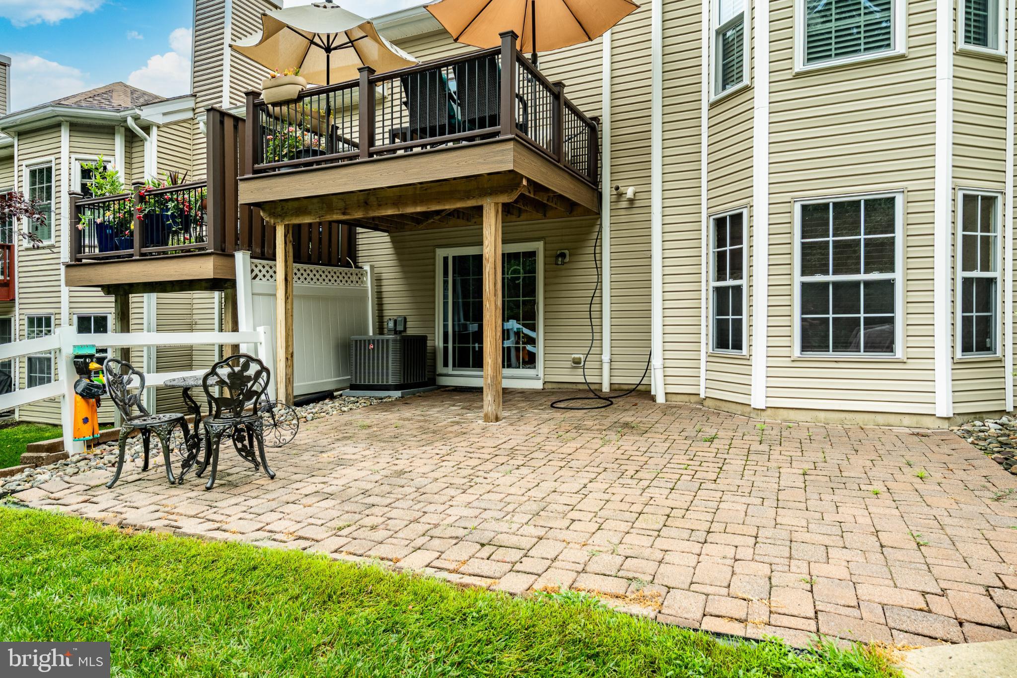 71 Dresner Circle Upper Chichester, PA 19061 - Photo 44 of 46 a view of a brick house with a chairs and table in a patio