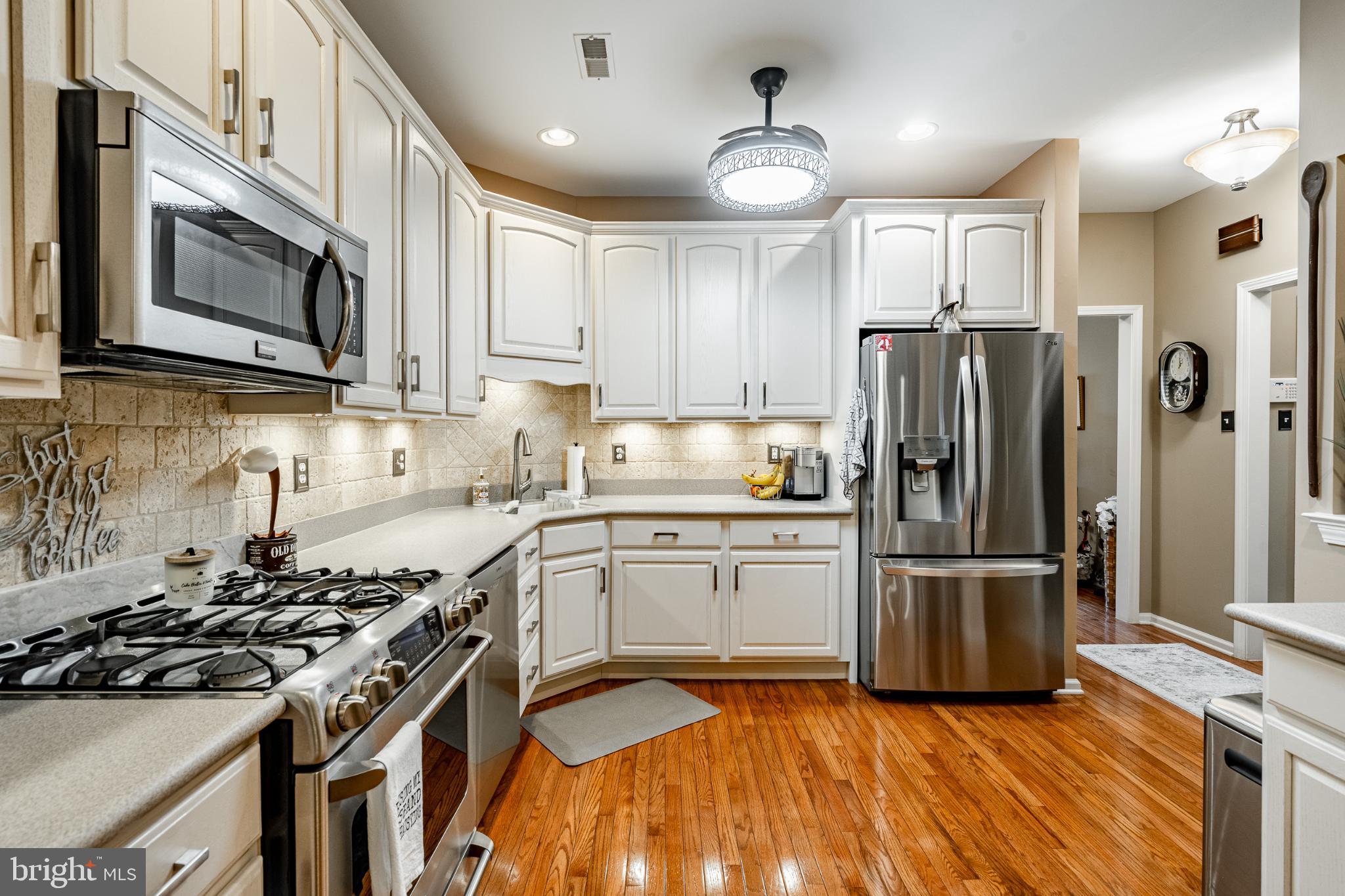71 Dresner Circle Upper Chichester, PA 19061 - Photo 8 of 46 a kitchen with granite countertop a sink stove and refrigerator