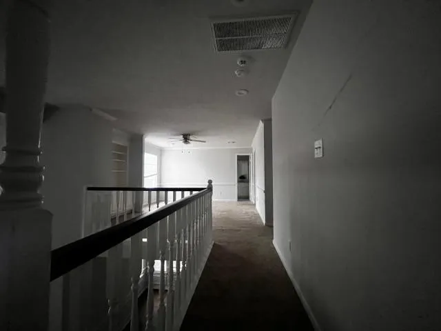 a view of gallery with stairs