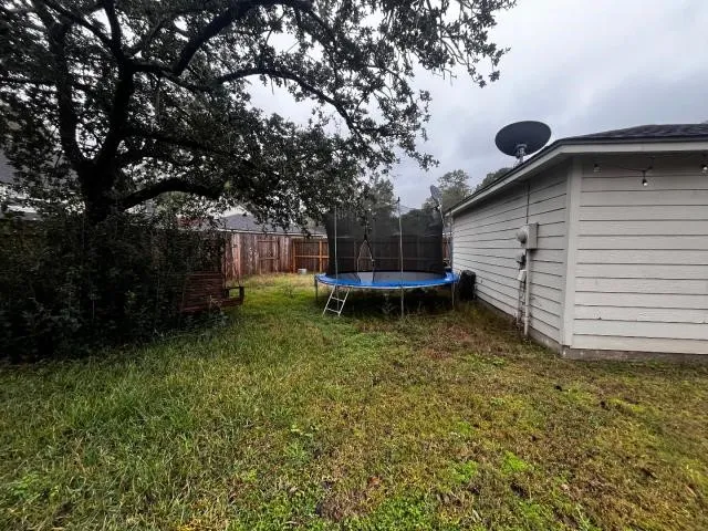 a backyard of a house with lots of green space