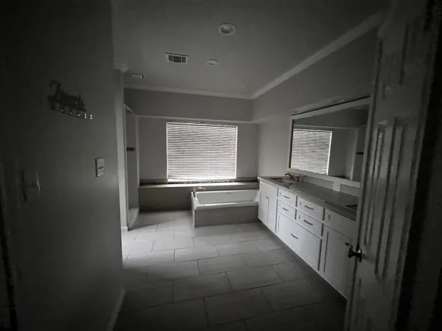 a kitchen with stainless steel appliances a sink stove and cabinets