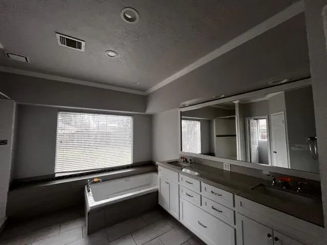 a kitchen with granite countertop a stove and a sink