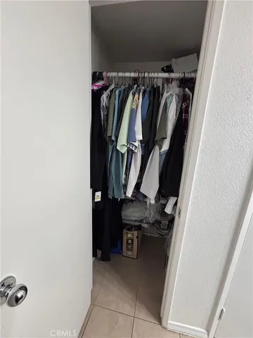 a kitchen with granite countertop wood cabinets and stainless steel appliances