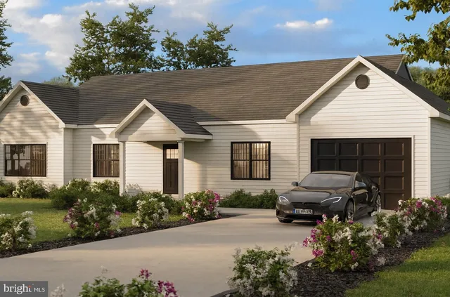 a view of a house with furniture and garden