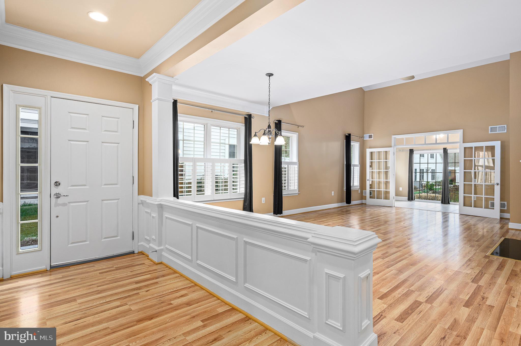44422 Sunset Maple Drive Ashburn, VA 20147 - Photo 13 of 40 a view of an empty room with wooden floor and a window