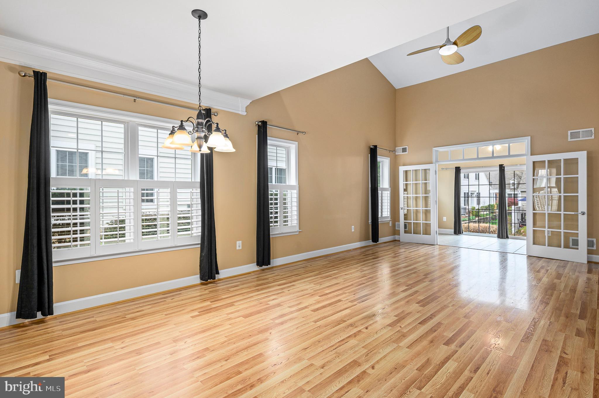 44422 Sunset Maple Drive Ashburn, VA 20147 - Photo 15 of 40 a view of an empty room with wooden floor and a window