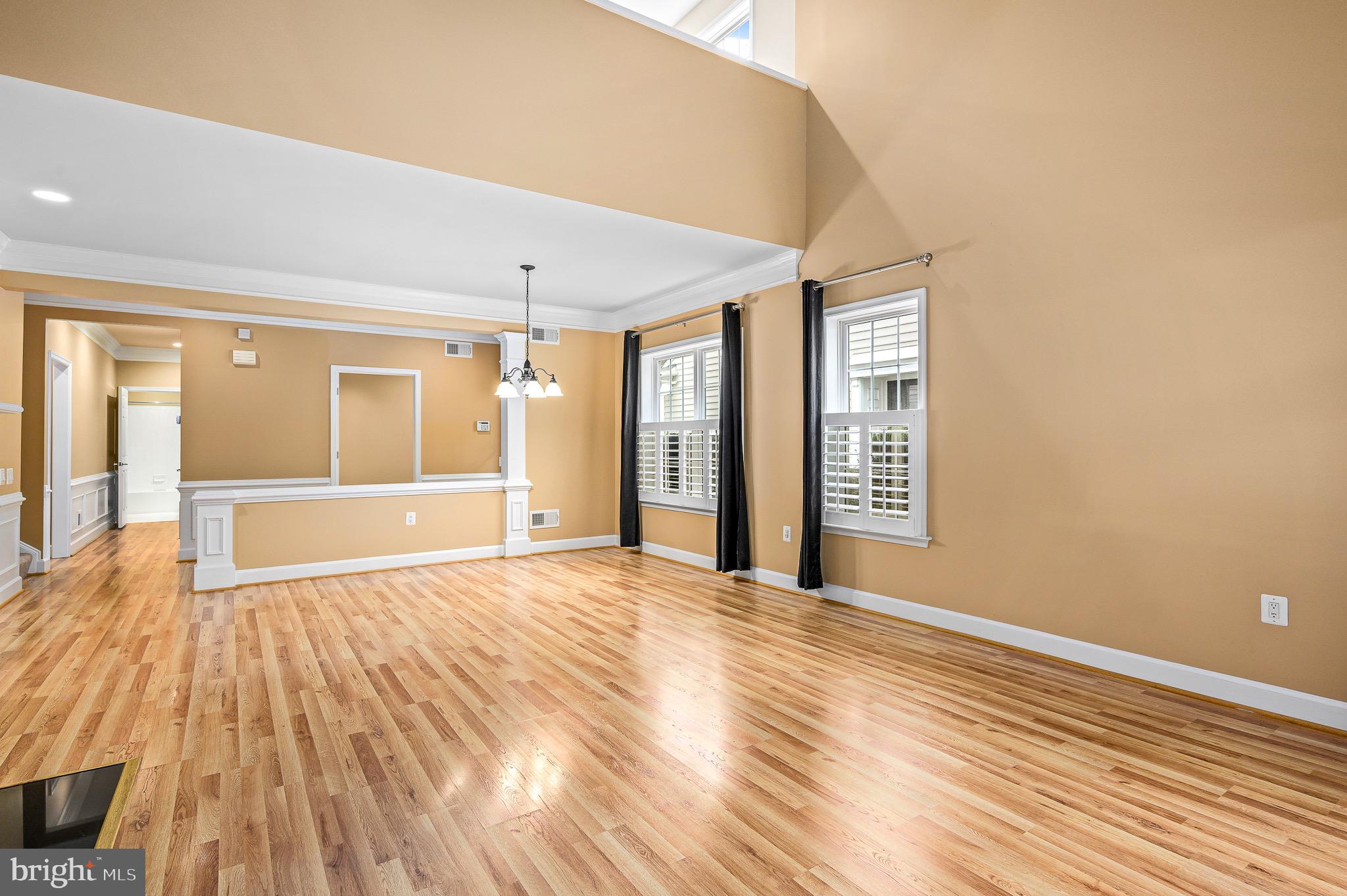 44422 Sunset Maple Drive Ashburn, VA 20147 - Photo 20 of 40 a view of an empty room with wooden floor and a window