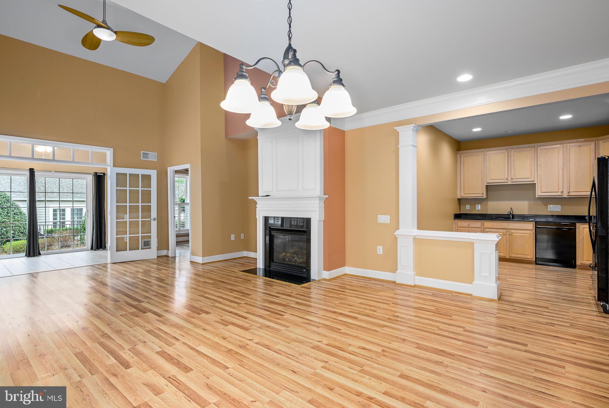 44422 Sunset Maple Drive Ashburn, VA 20147 - Photo 2 of 40 a view of a kitchen with stove and wooden floor