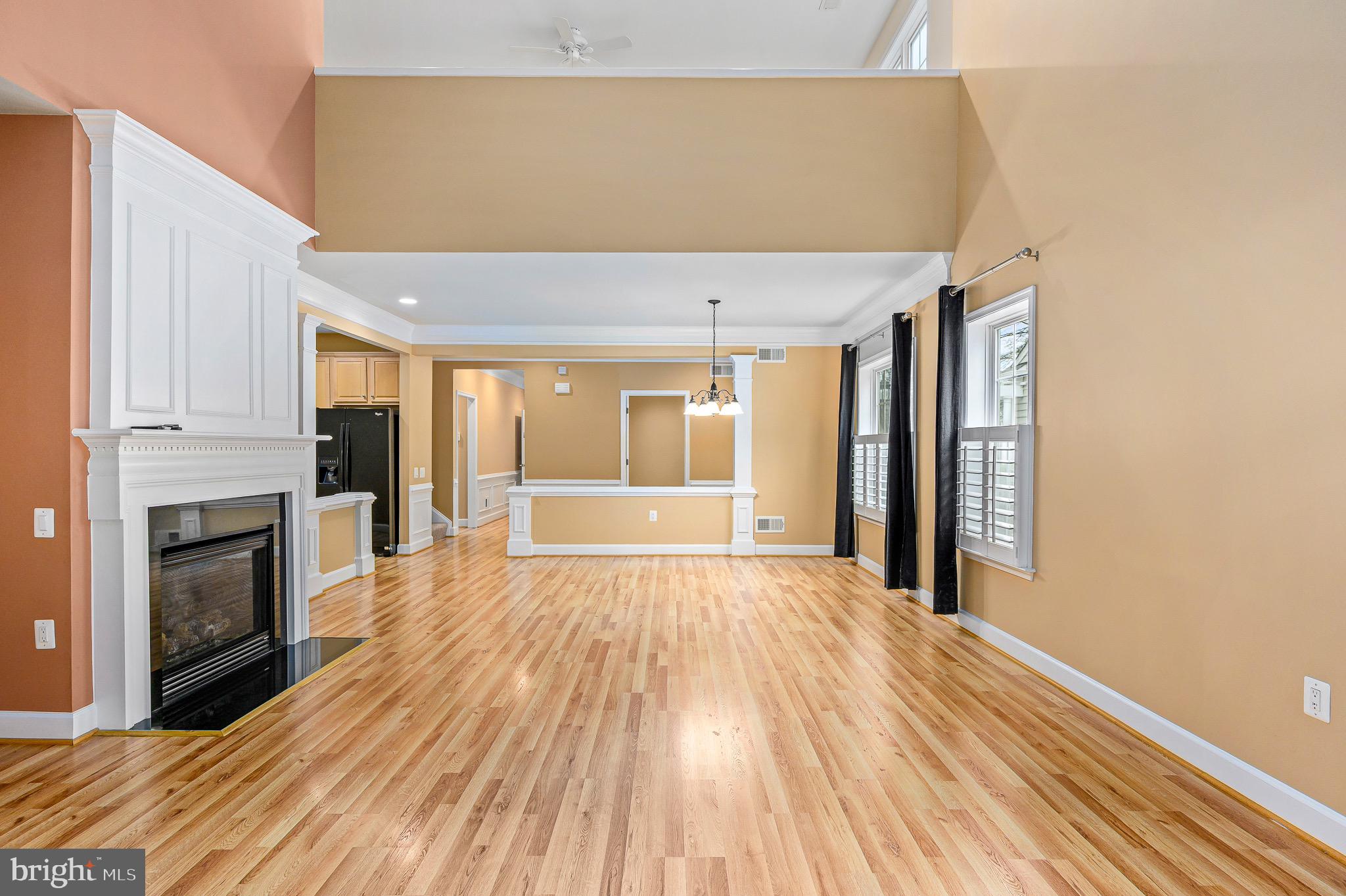 44422 Sunset Maple Drive Ashburn, VA 20147 - Photo 21 of 40 a view of an empty room with a fireplace and a window