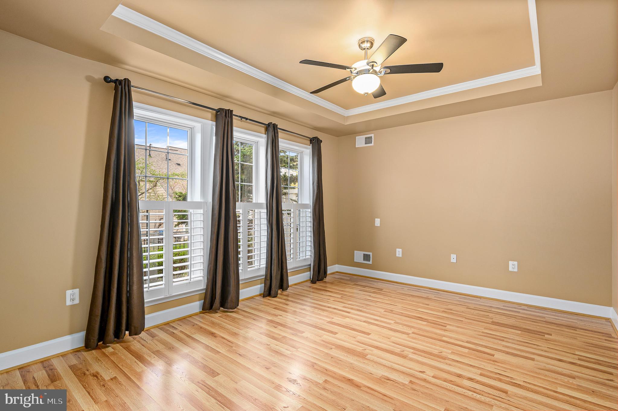 44422 Sunset Maple Drive Ashburn, VA 20147 - Photo 25 of 40 a view of a room with a ceiling fan and wooden floor