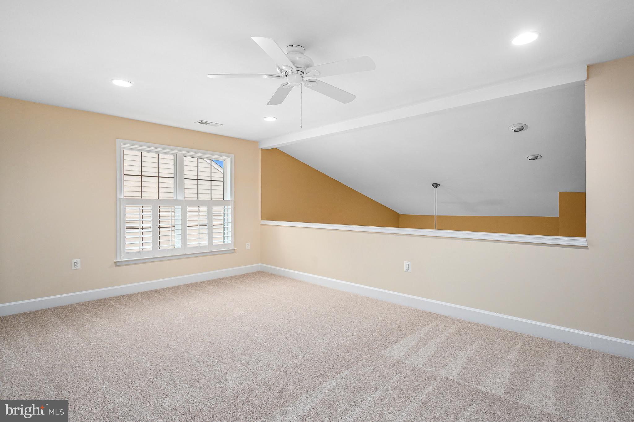 44422 Sunset Maple Drive Ashburn, VA 20147 - Photo 35 of 40 an empty room with windows and fan