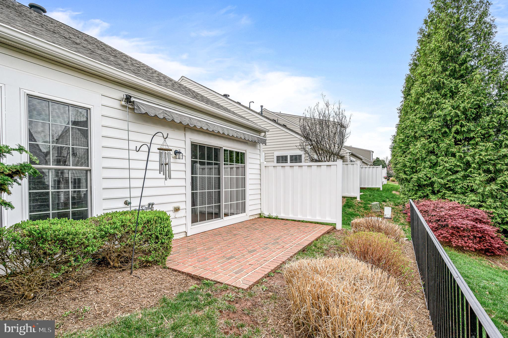 44422 Sunset Maple Drive Ashburn, VA 20147 - Photo 10 of 40 a front view of a house with a garden