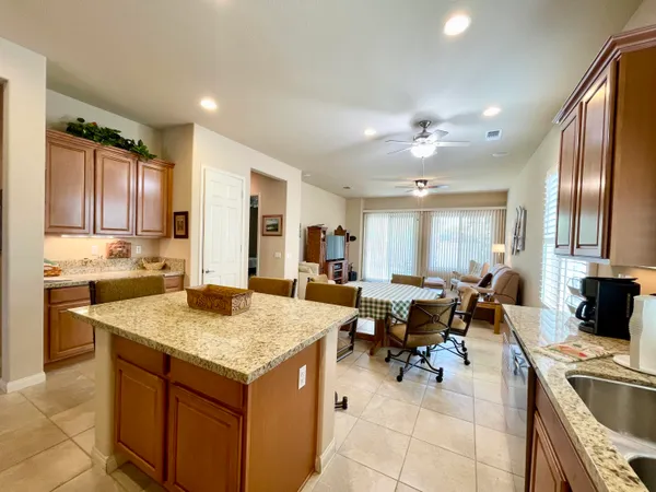 a kitchen with a stove sink and cabinets