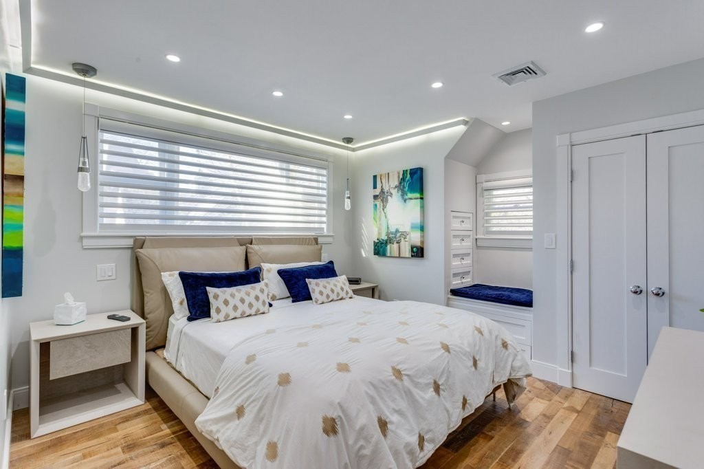 7 Brewer Street, Unit 2 Boston, MA 02130 - Photo 14 of 18 a bedroom with a bed and a night stand