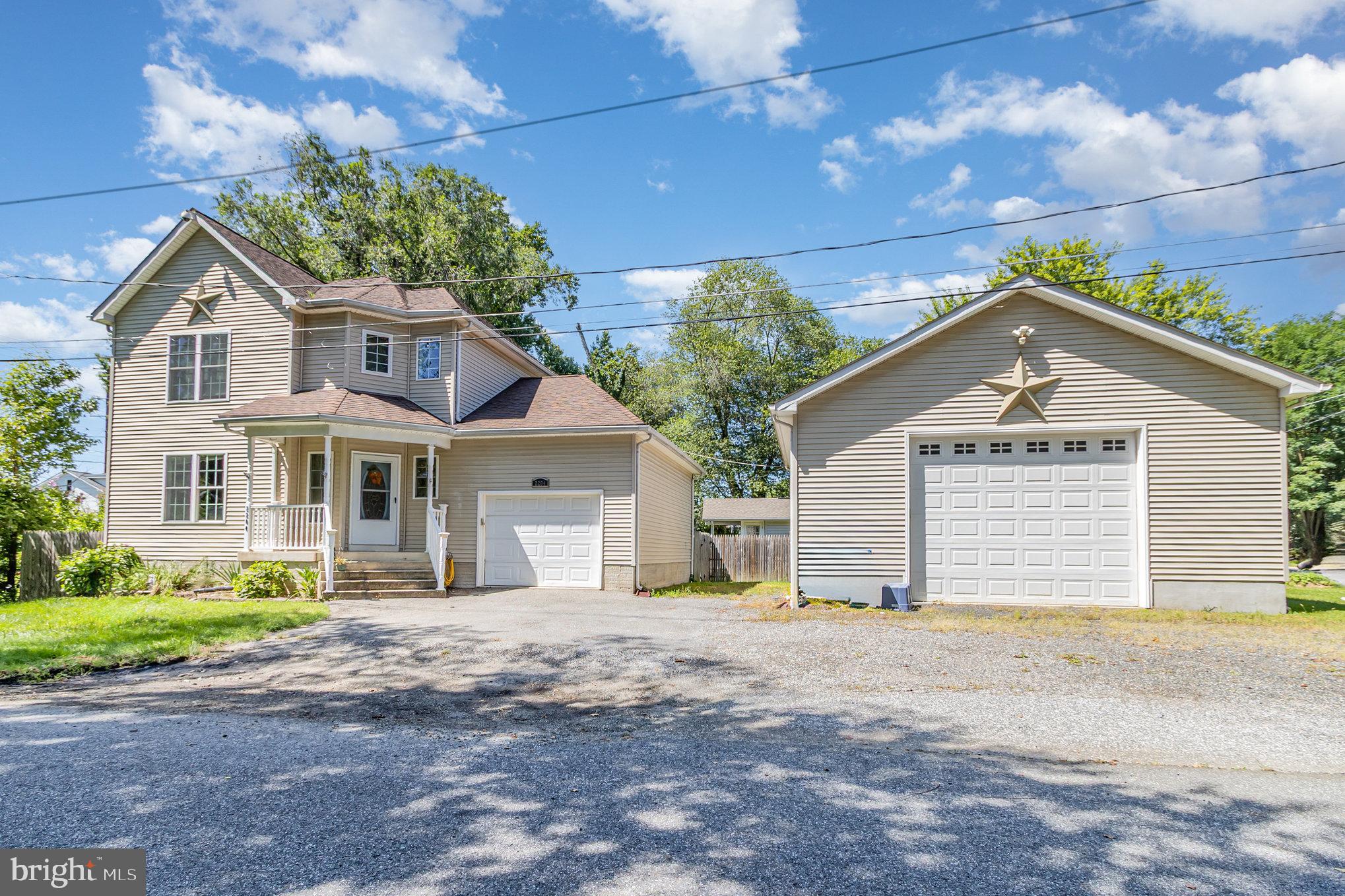 2204 Blevins Road Edgewood, MD 21040 - Photo 1 of 28 a front view of a house with a garden and trees