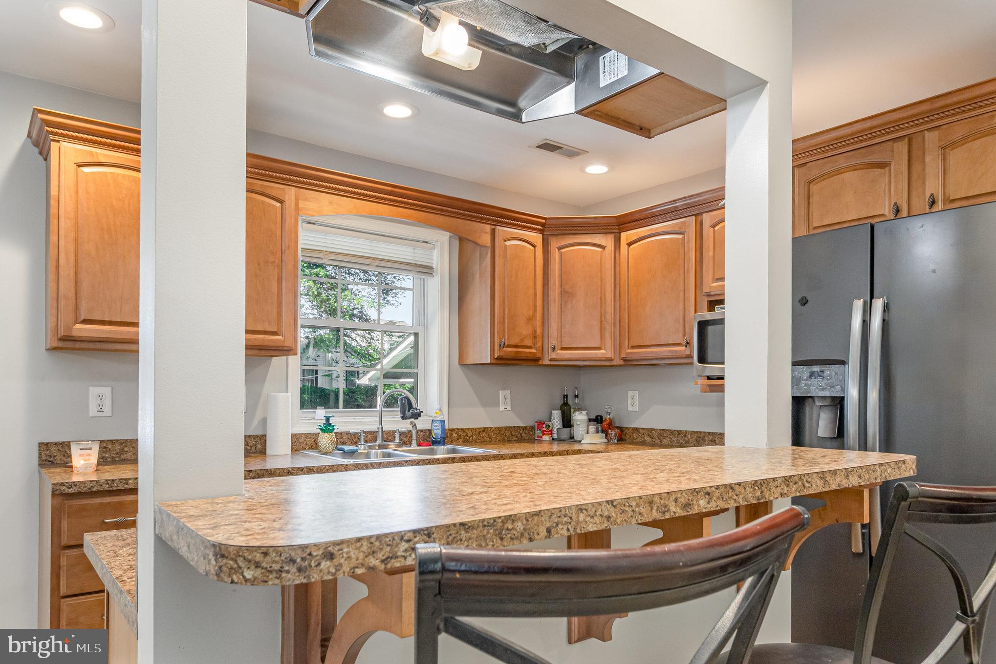 2204 Blevins Road Edgewood, MD 21040 - Photo 11 of 28 a kitchen with stainless steel appliances granite countertop a sink stove and refrigerator