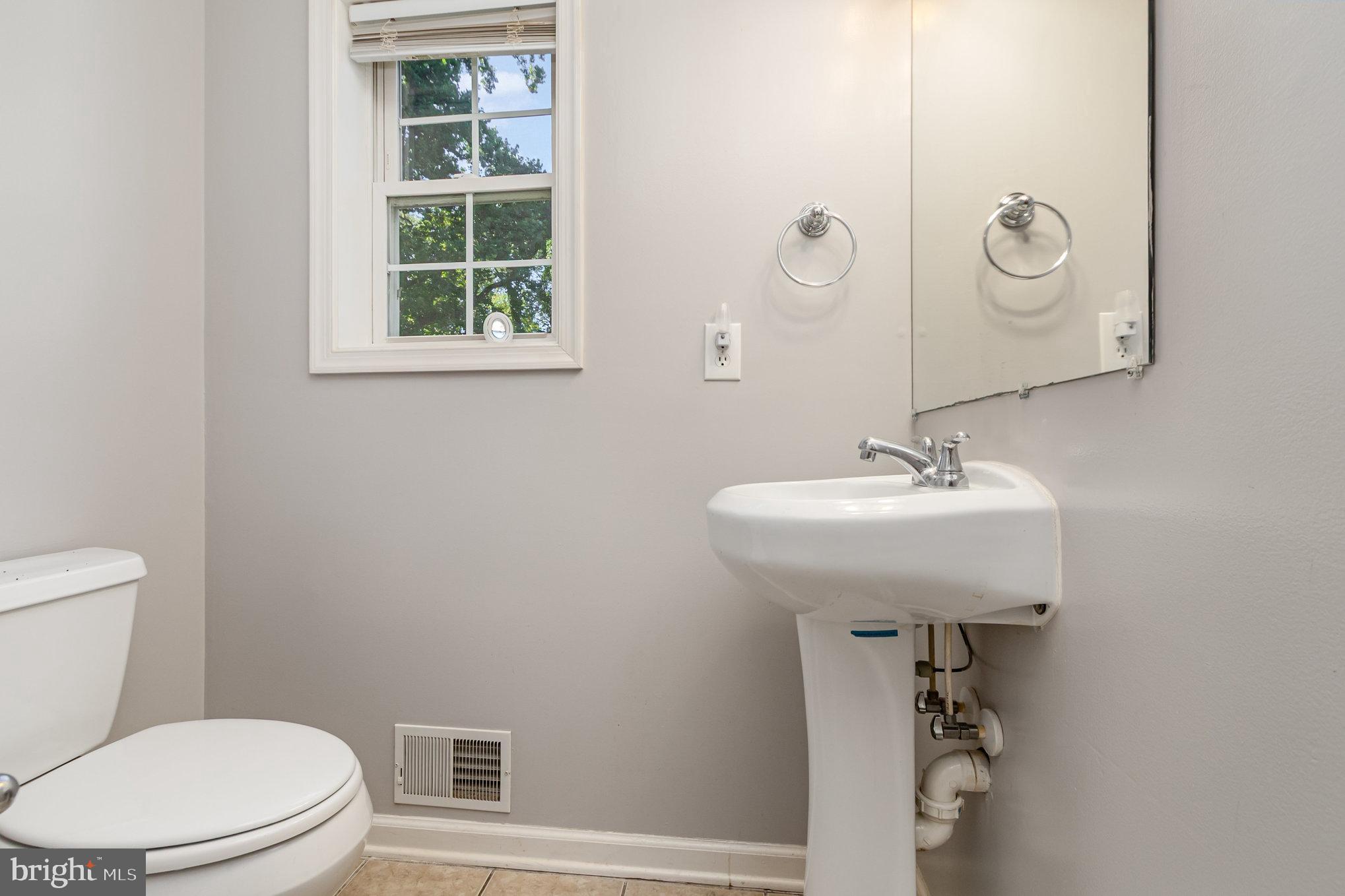 2204 Blevins Road Edgewood, MD 21040 - Photo 14 of 28 a bathroom with a sink toilet and a mirror