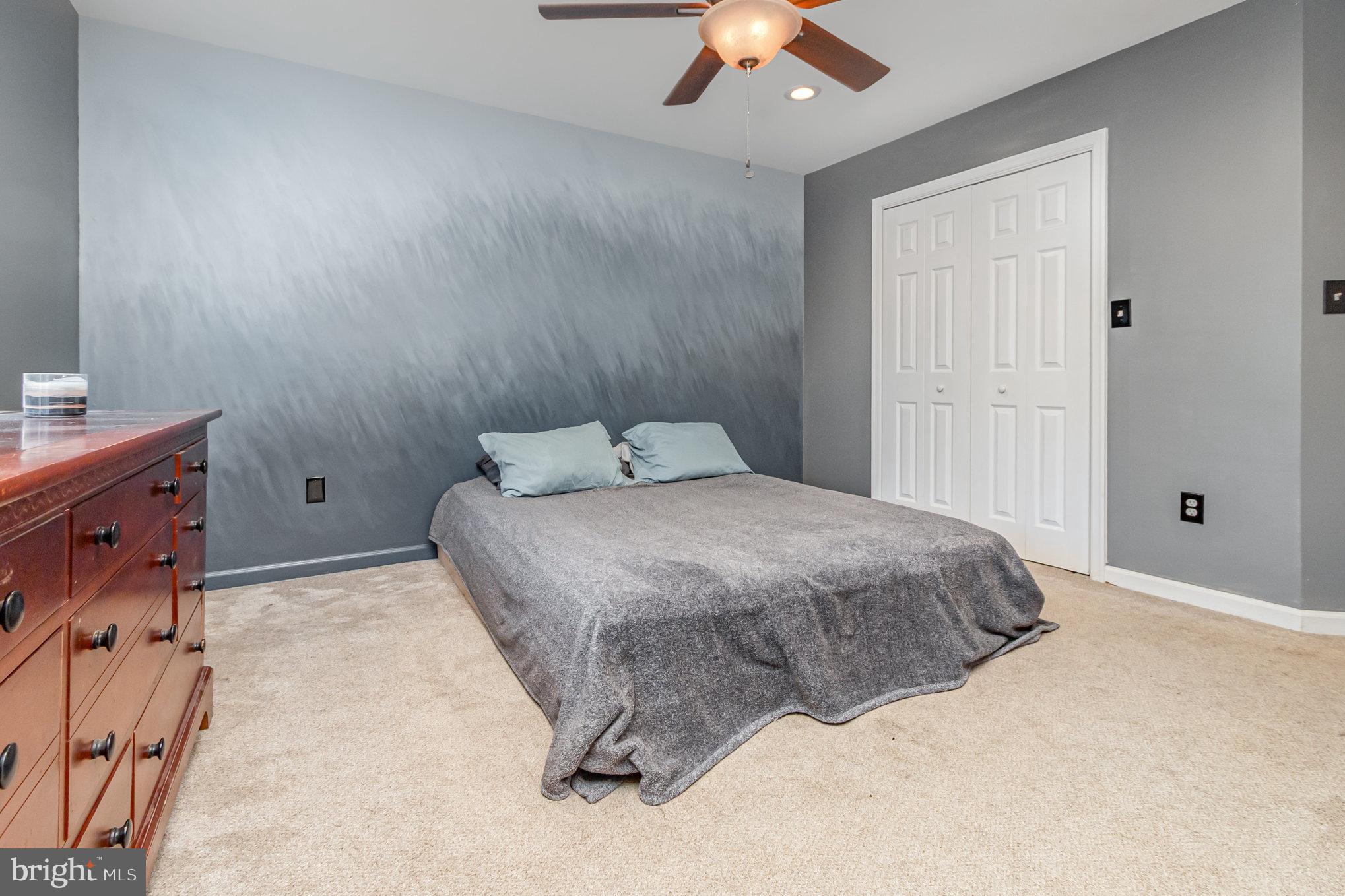 2204 Blevins Road Edgewood, MD 21040 - Photo 15 of 28 a bedroom with a bed and a chandelier