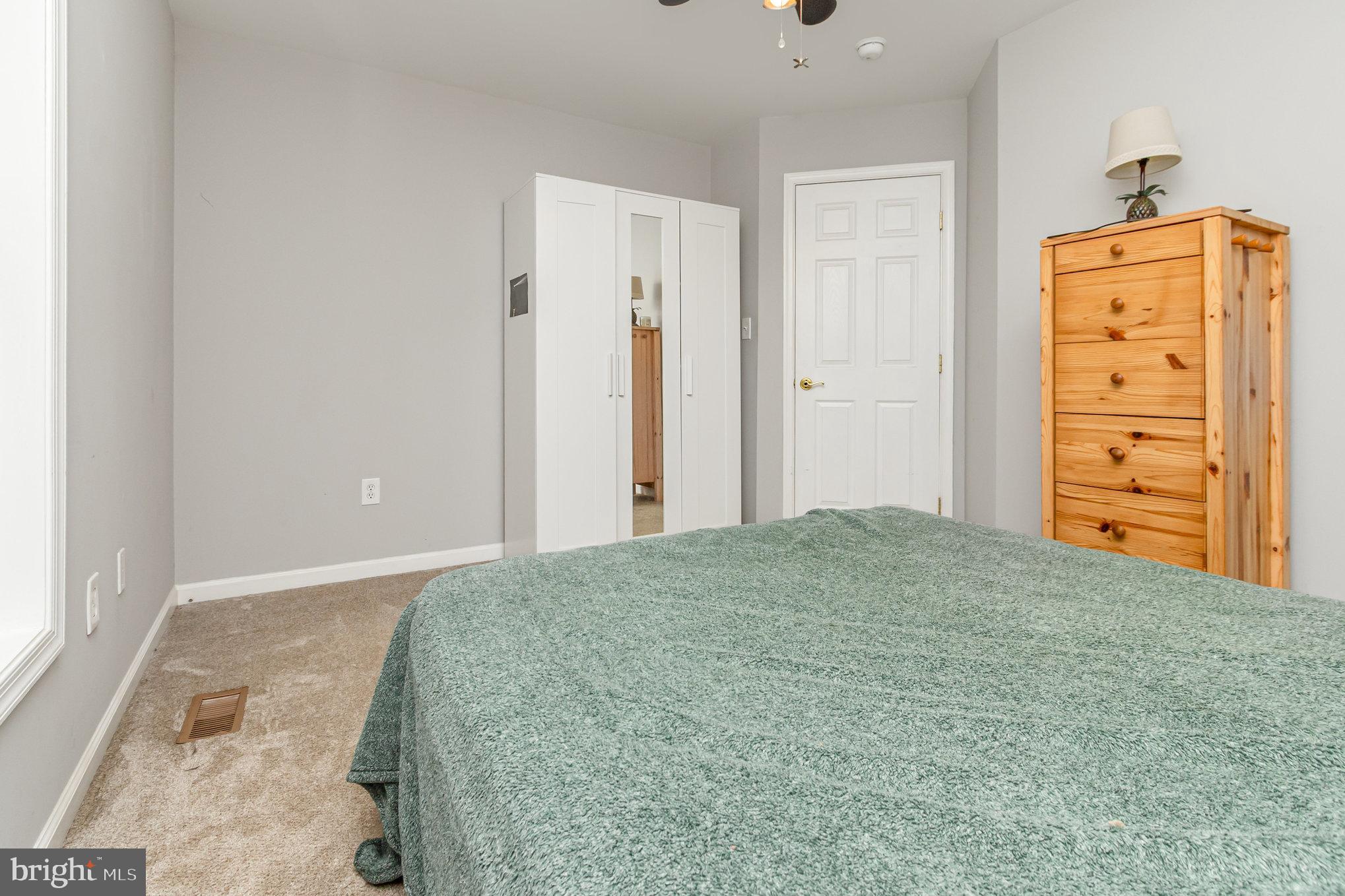 2204 Blevins Road Edgewood, MD 21040 - Photo 19 of 28 a bedroom with a bed and cabinets