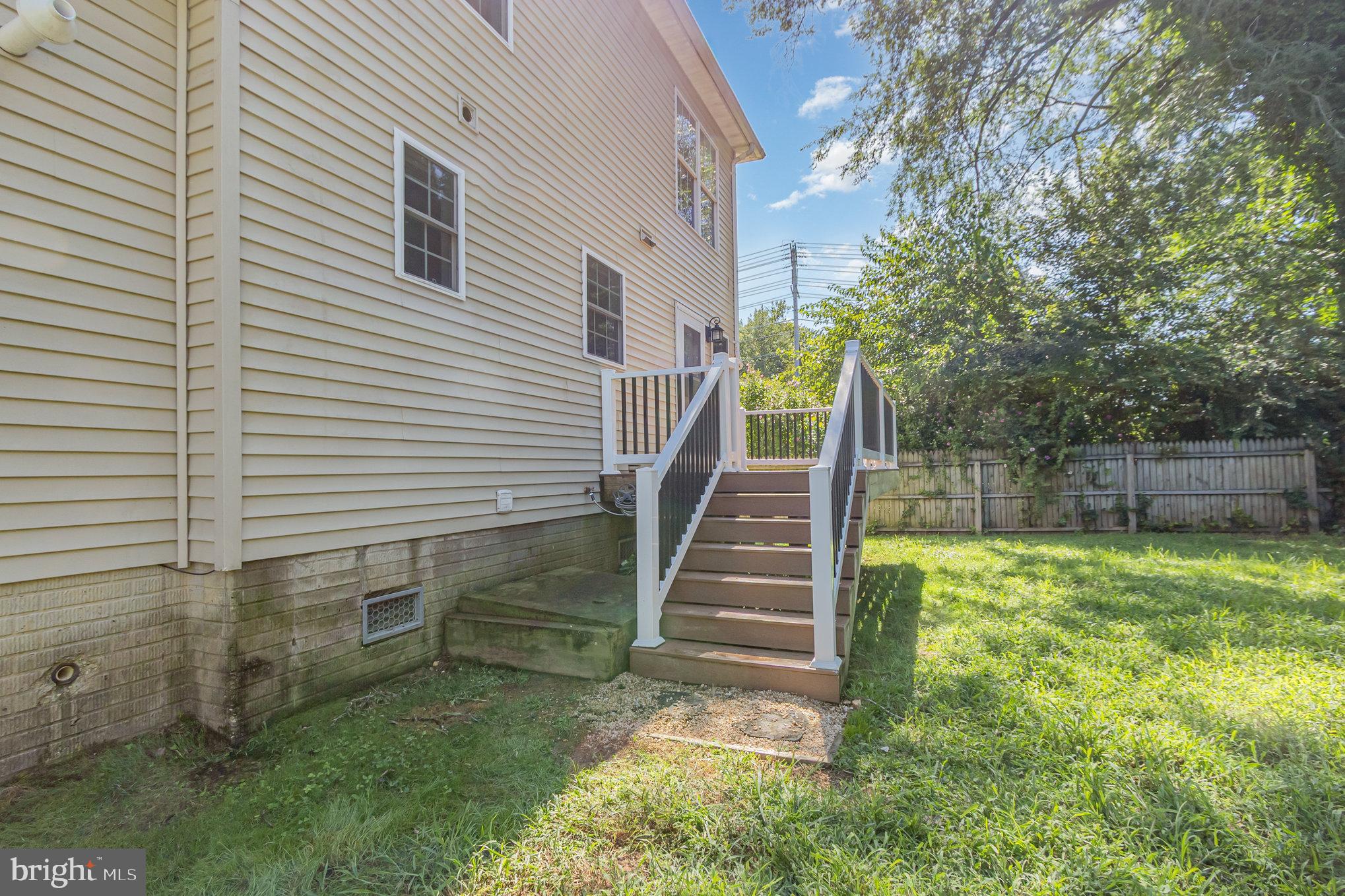 2204 Blevins Road Edgewood, MD 21040 - Photo 25 of 28 a view of backyard with wooden fence and a large tree