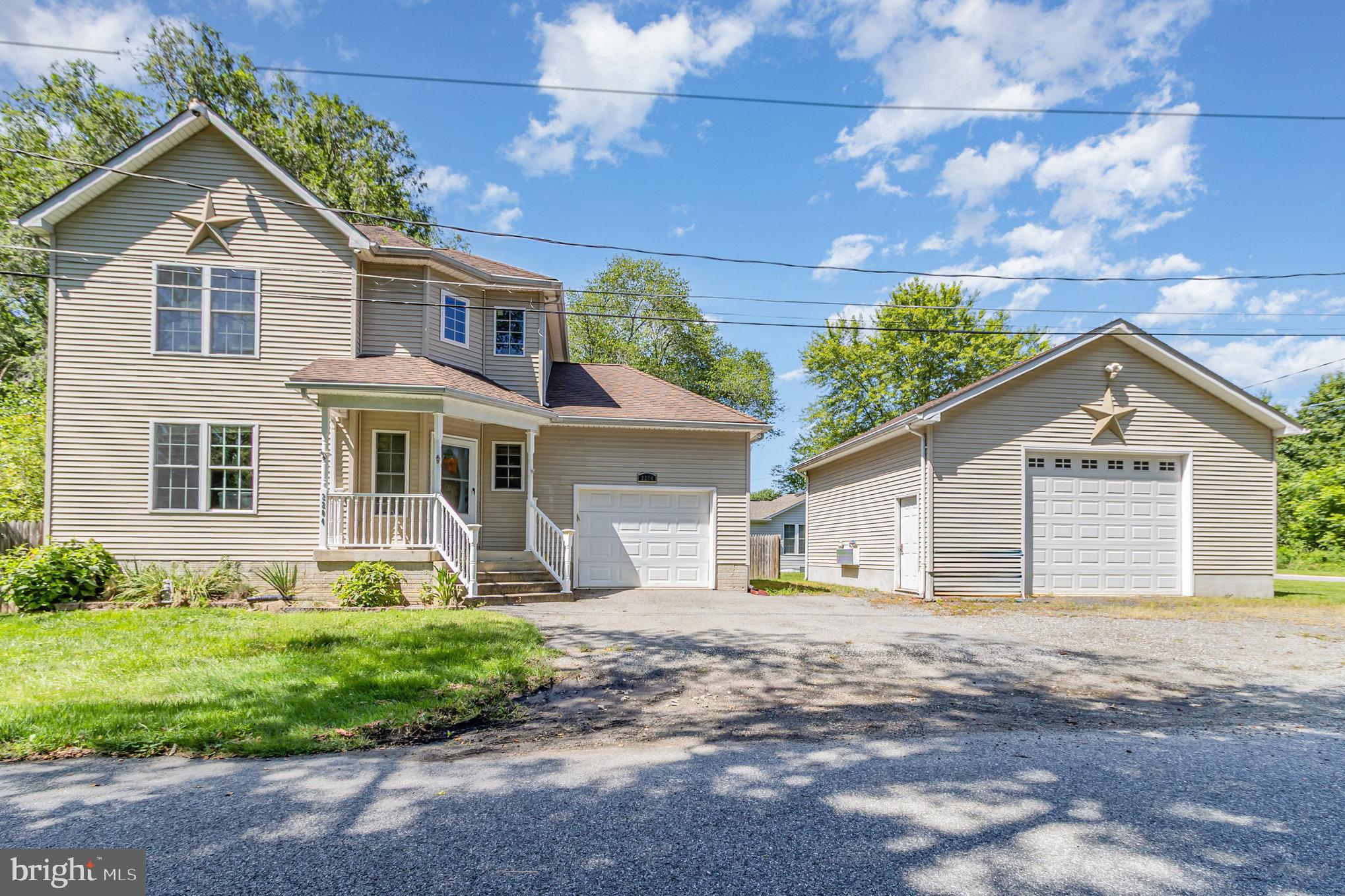 2204 Blevins Road Edgewood, MD 21040 - Photo 3 of 28 a front view of a house with a yard and garage