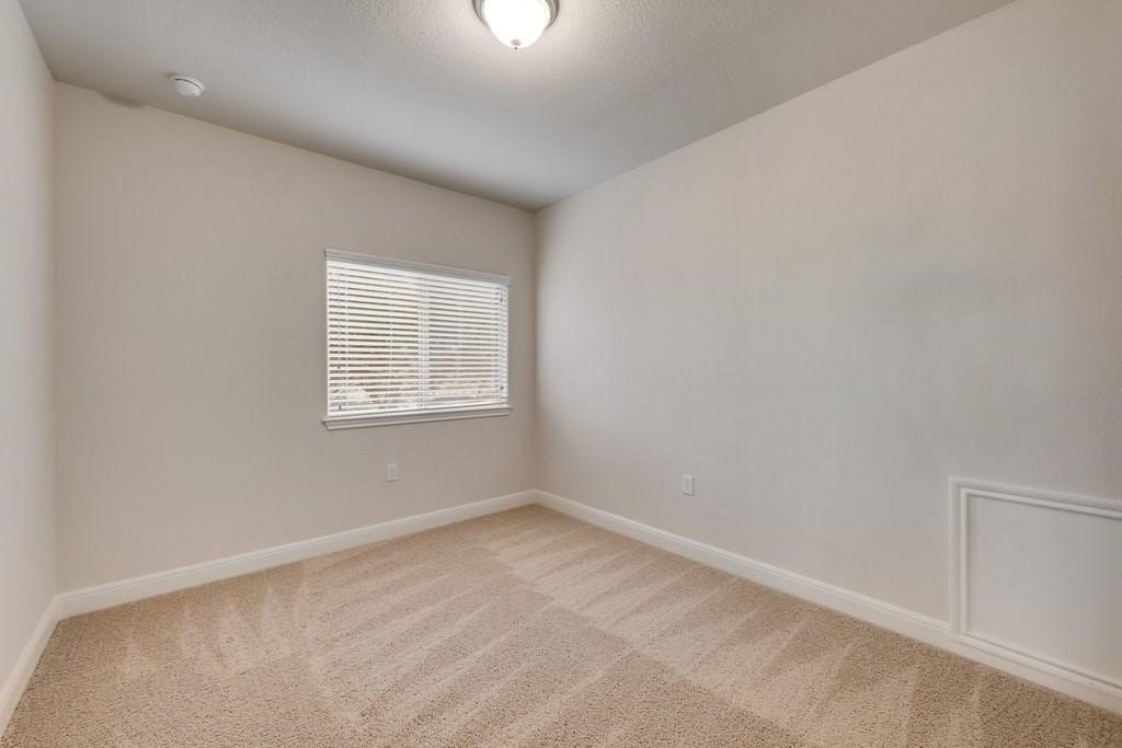 10825 Ballard Path Austin, TX 78717 - Photo 31 of 39 an empty room with a window
