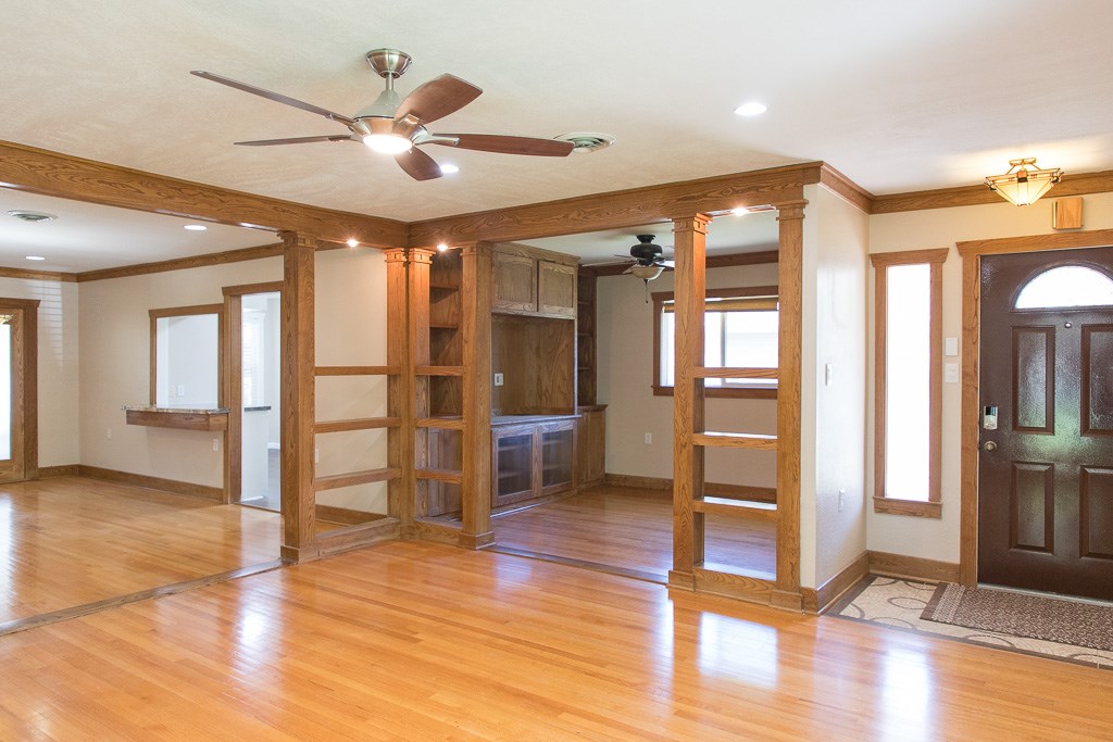 9010 Linkmeadow Lane Houston, TX 77025 - Photo 14 of 39 a view of a livingroom with wooden floor and a ceiling fan